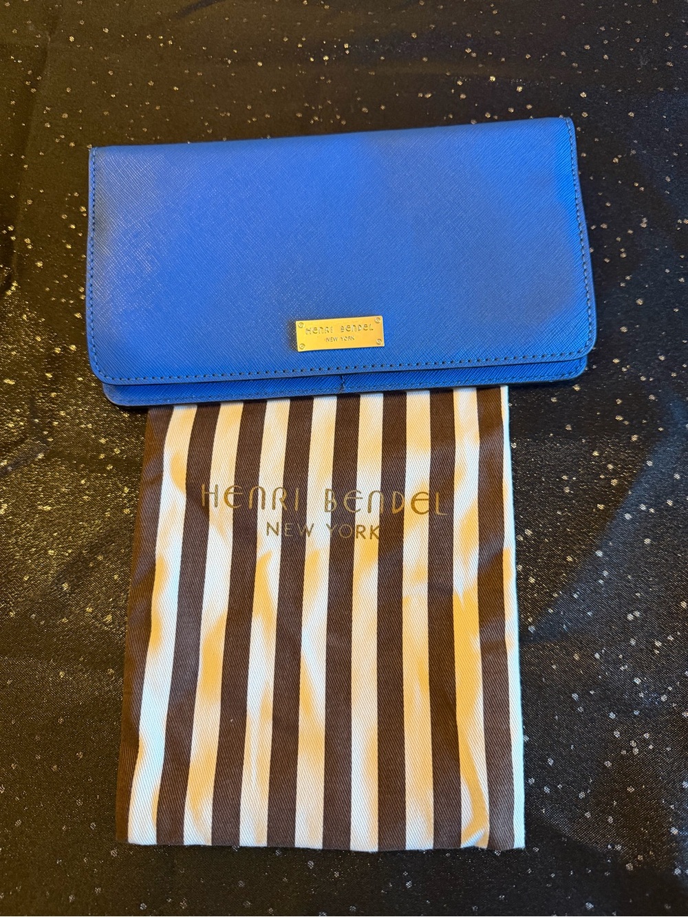 henri bendel royal blue leather phone wallet with gold plaque